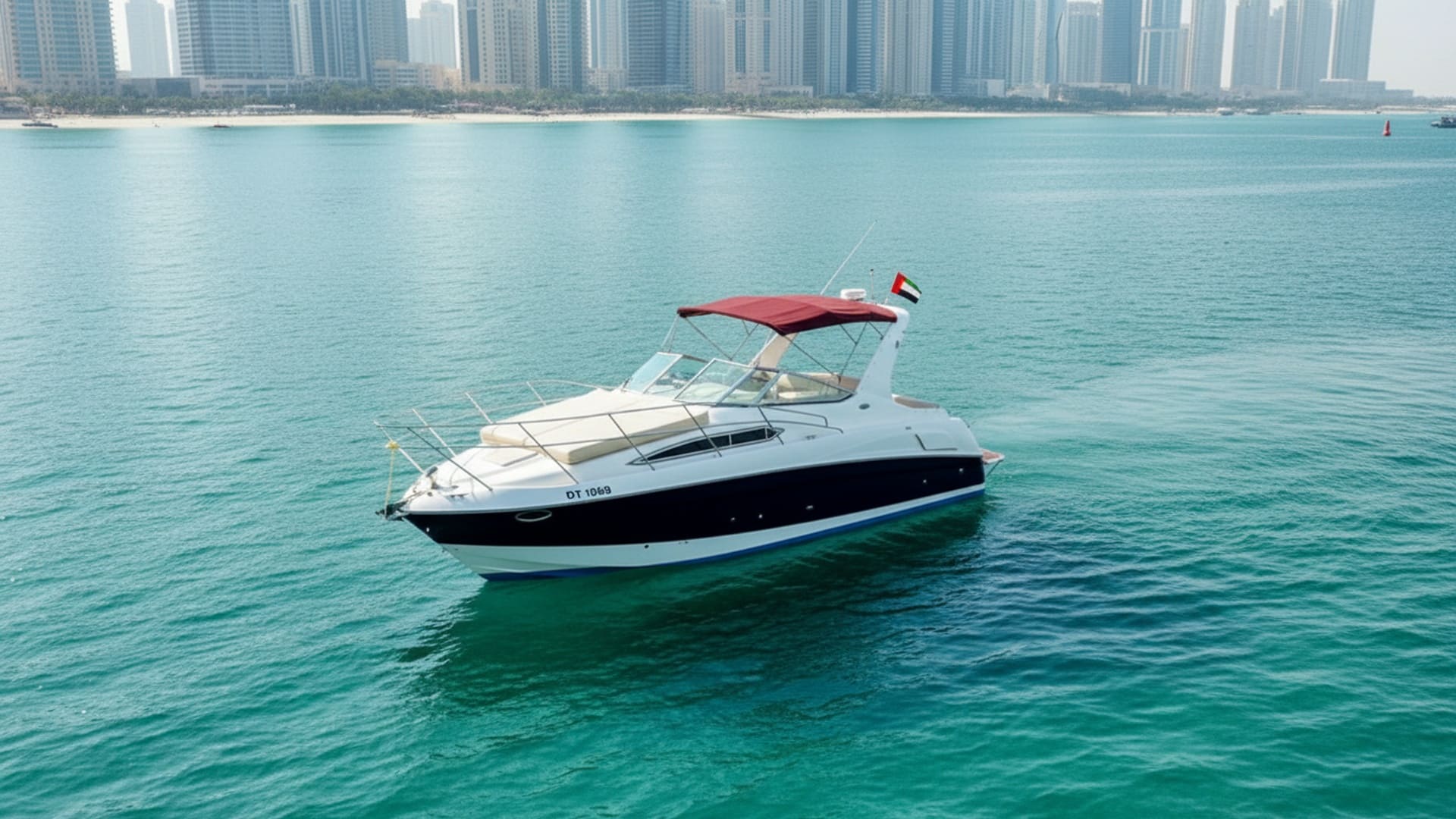 Aerial view of Moonlight Star 33 ft cruising Dubai Marina
